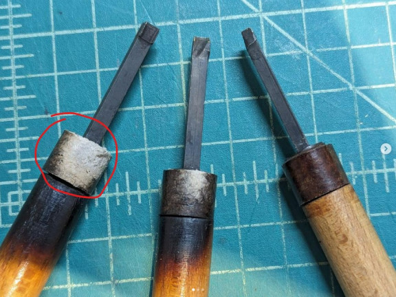 Houten handvat met asbest buffer